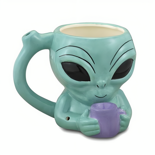a mug with a alien face