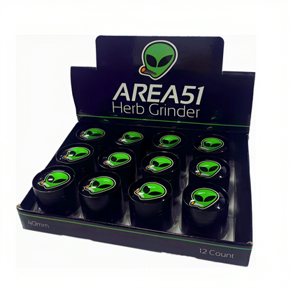 a box of grinder with green and black containers