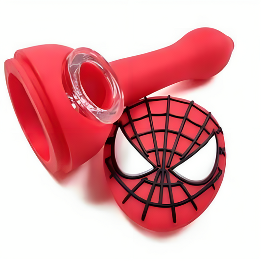 a red plastic pipe with a spider-person face on it