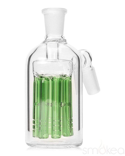 a glass bottle and green liquid in it